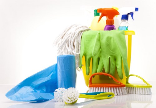 Cleaning team working carefully with safety procedures in place