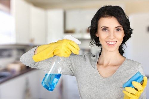 Watford cleaner using protective equipment during service