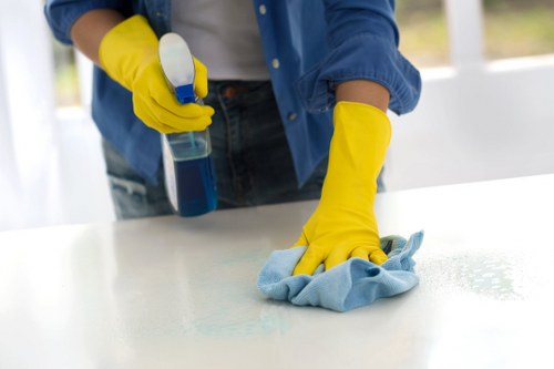 Team performing office cleaning in a modern Watford business setting